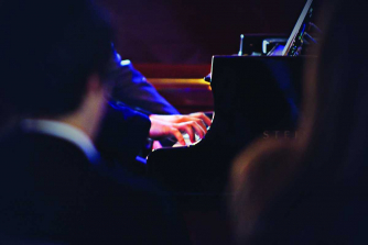 A competitor at the keyboard at the Leeds Conservatoire Piano Competition