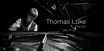 Thomas Luke playing the piano Thomas Luke playing the piano
