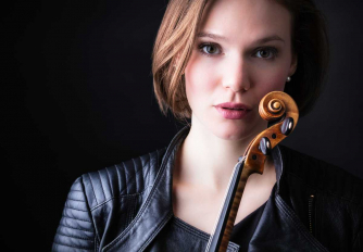 Tamsin Waley-Cohen holding her violin Tamsin Waley-Cohen holding her violin