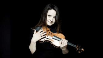 Baiba Skride holding her violin. Baiba Skride holding her violin.