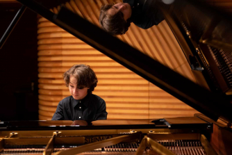 Yehudi Menuhin School pupil playing piano Yehudi Menuhin School pupil playing piano