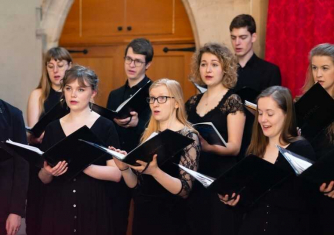 Members of Schola Cantorum singing Members of Schola Cantorum singing
