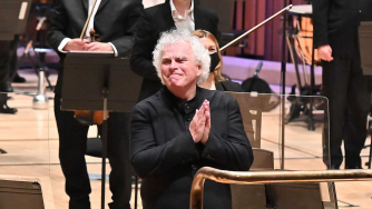 Photo of Sir Simon Rattle at the Barbican. Photo of Sir Simon Rattle at the Barbican.