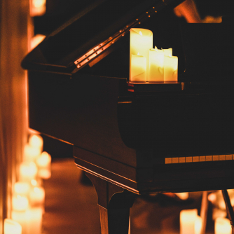 A piano with candles on it A piano with candles on it