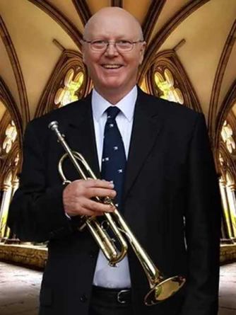 Crispian Steele Perkins in a church, holding a trumpet Crispian Steele Perkins in a church, holding a trumpet