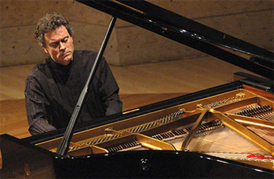 Paul Lewis playing the piano